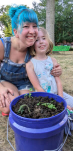 mom and child with their micro-garden salsa bucket